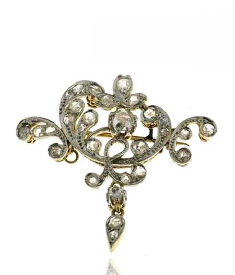 Yellow gold brooch set with diamonds