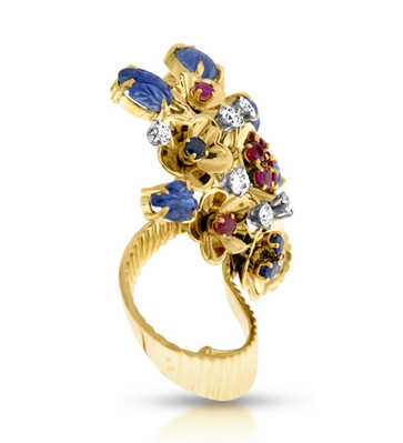 Yellow gold brooc decorated with diamonds, cabochon sapphires, rubies and sapphires