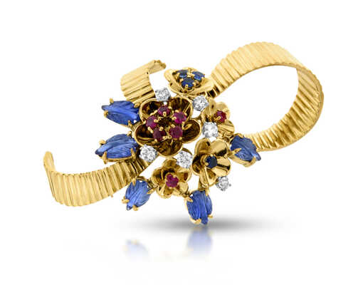 Yellow gold brooc decorated with diamonds, cabochon sapphires, rubies and sapphires
