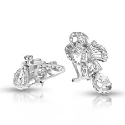 Platinum ear clips with 2 pear shaped diamonds, 4 baguettes and 64 brilliants