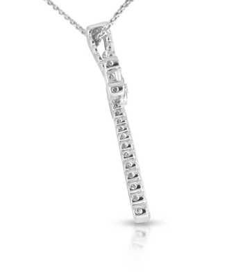 White gold cross with diamond brilliant and baguettes