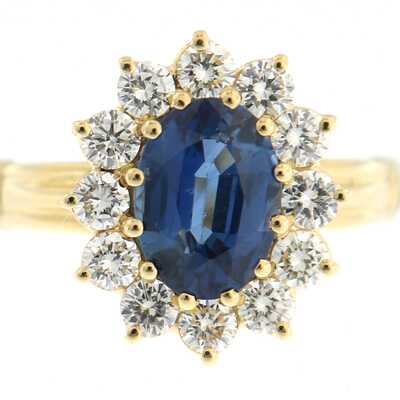 Yellow gold ring with oval sapphire and diamonds