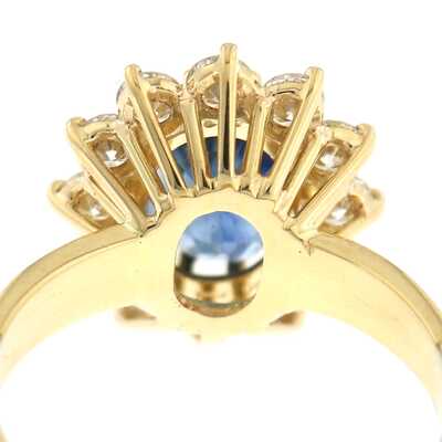 Yellow gold ring with oval sapphire and diamonds