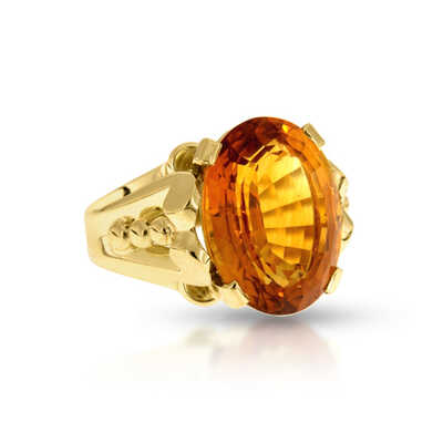 Yellow gold ring with topaz